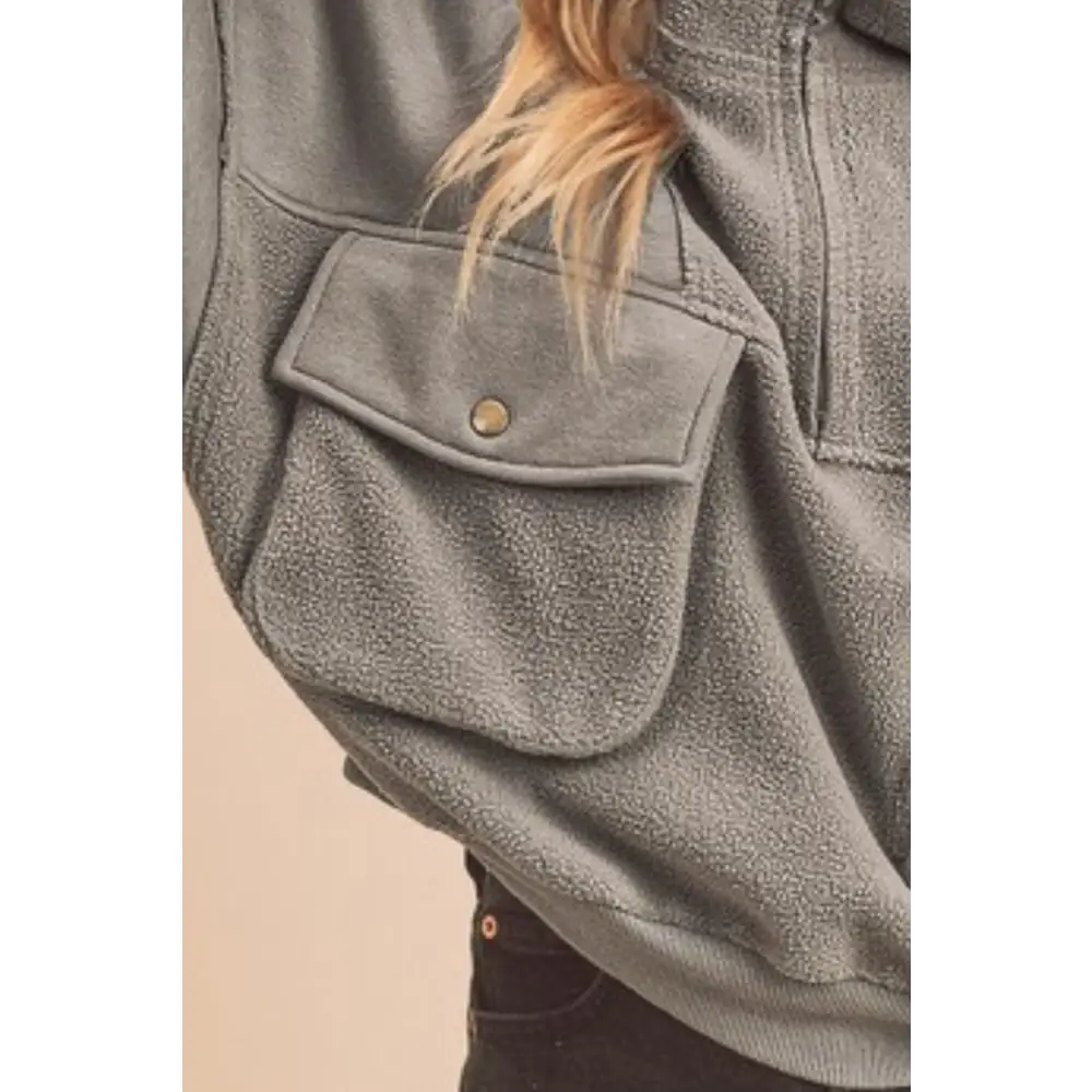 Exposed Seam Half Zip Sweatshirt with Pockets.