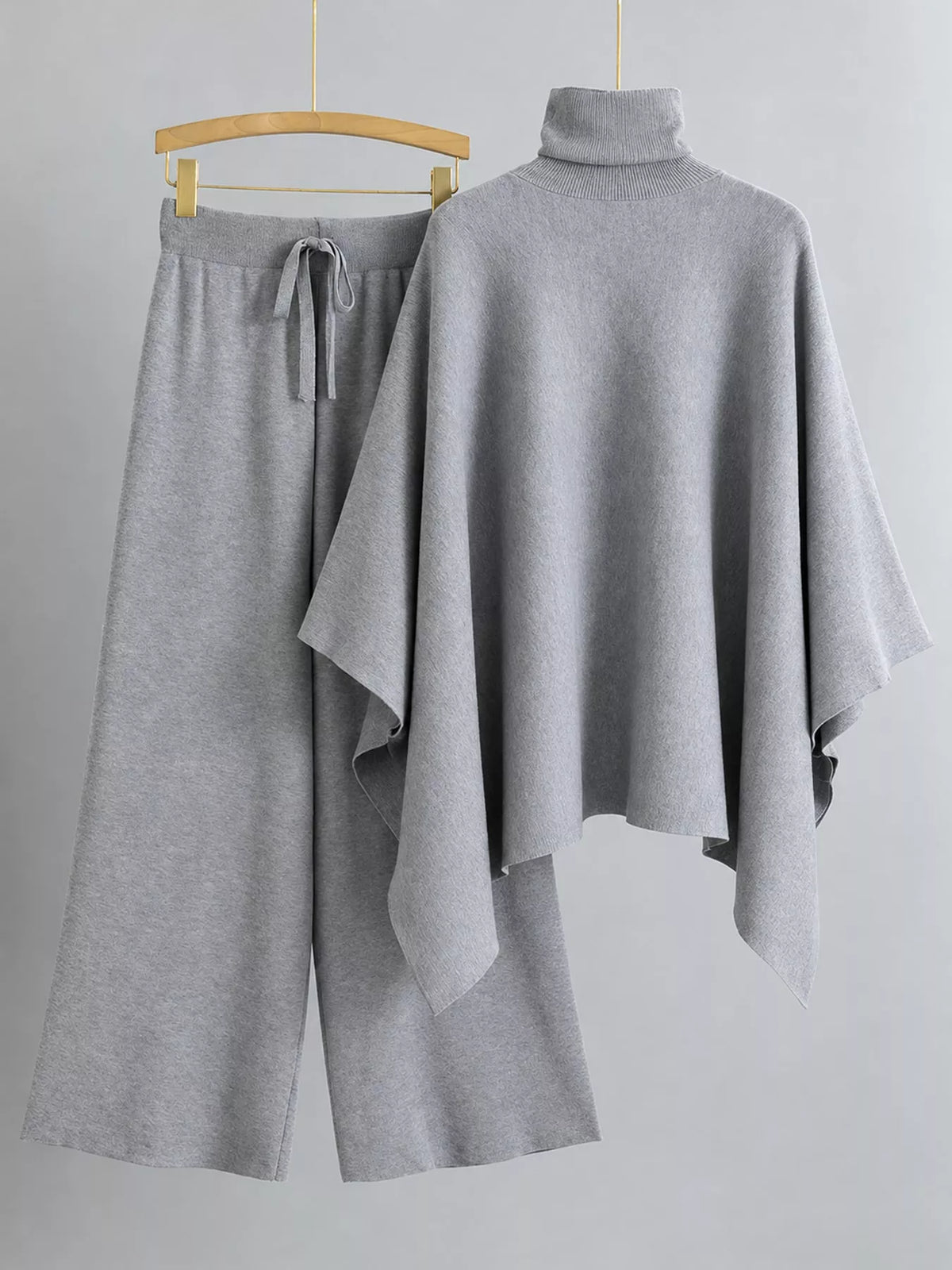 Turtleneck poncho sweater and matching wide-leg knit pants set