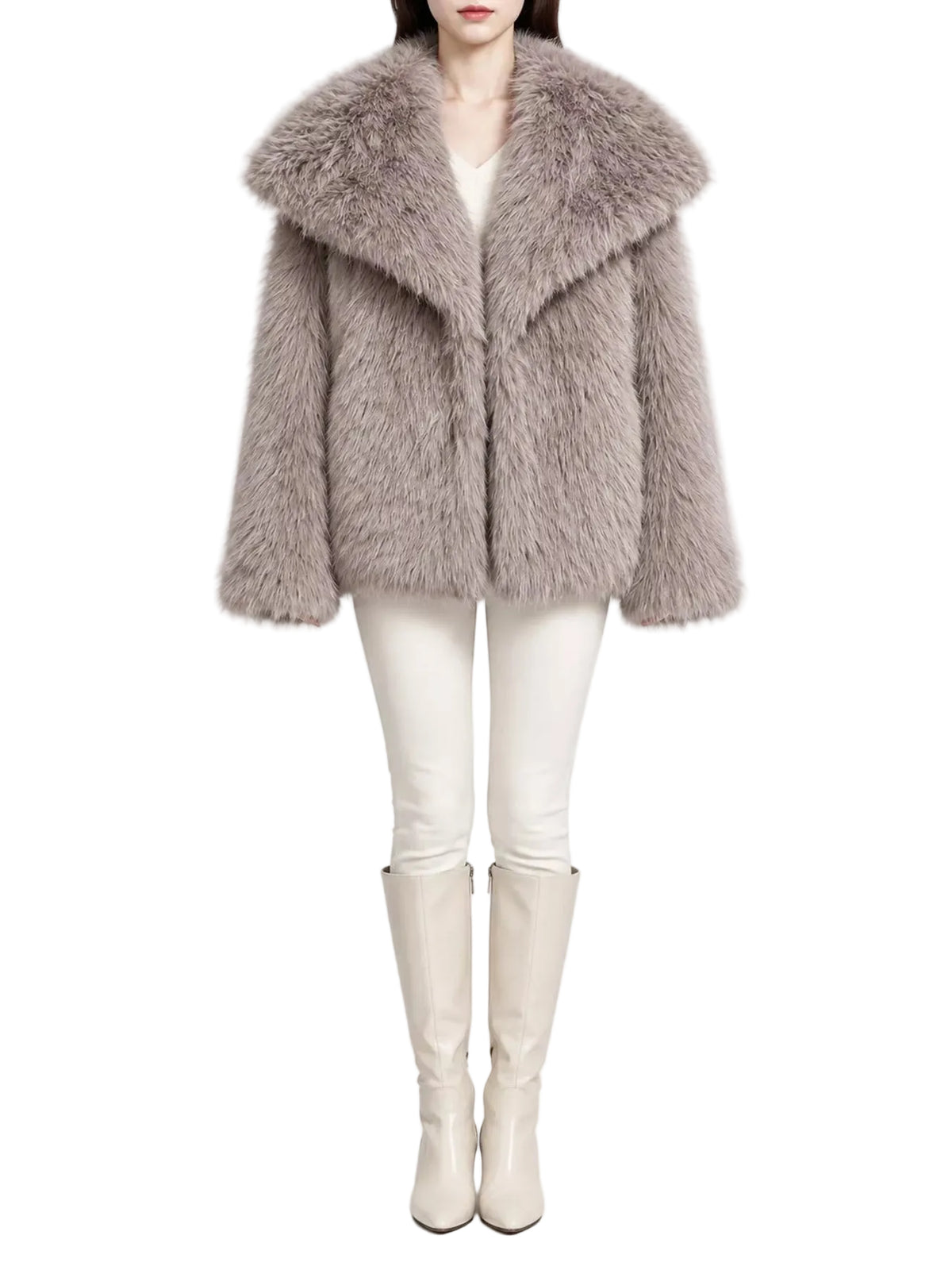 A model wearing a light taupe faux fur coat with a wide collar, paired with white pants and beige knee-high boots, shot against a plain white studio background.