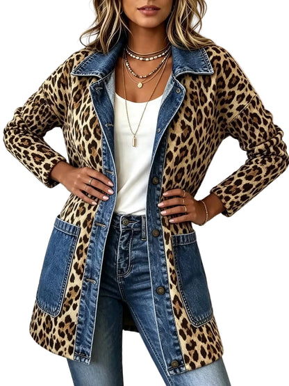 A woman models a long leopard-print and denim jacket with blue denim trim, worn open over a white top and blue jeans against a plain light background.