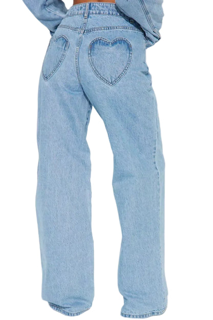 Light blue denim jeans with a heart-shaped pocket on the back, shown from the back on a model wearing a matching light blue denim jacket.