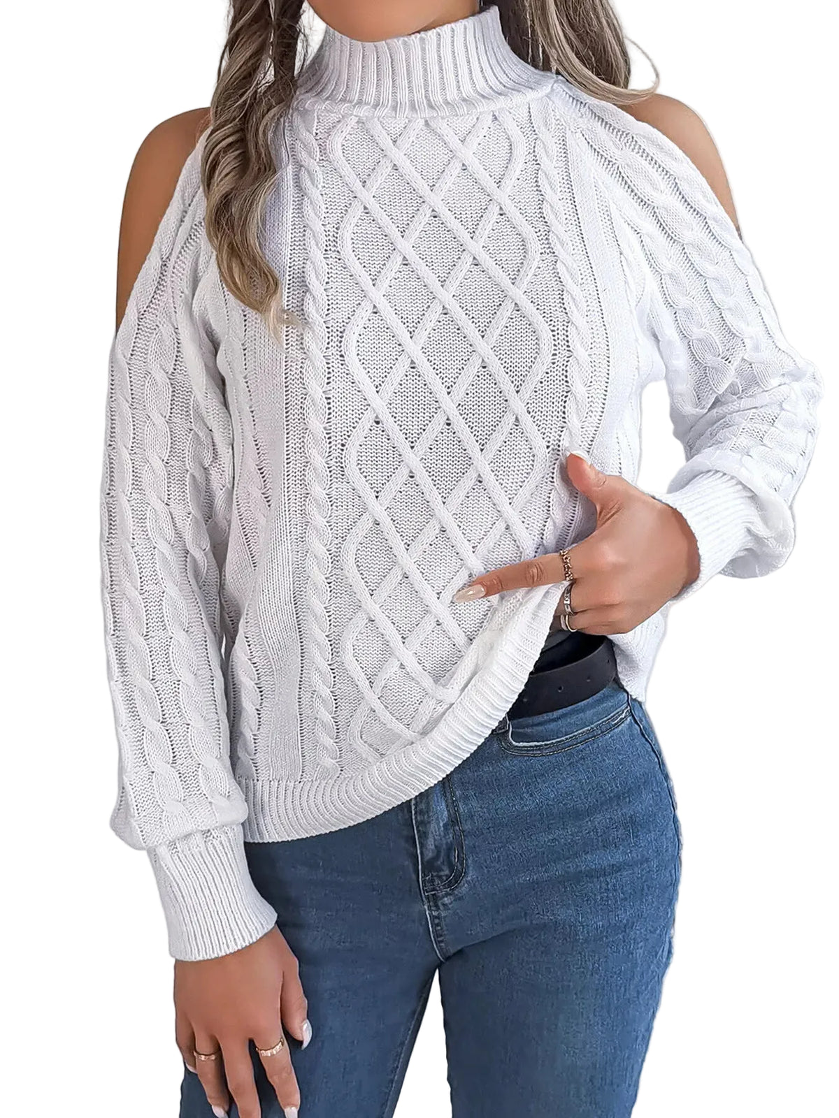 White cable knit sweater with cold shoulder design worn by a person, against a neutral background.
