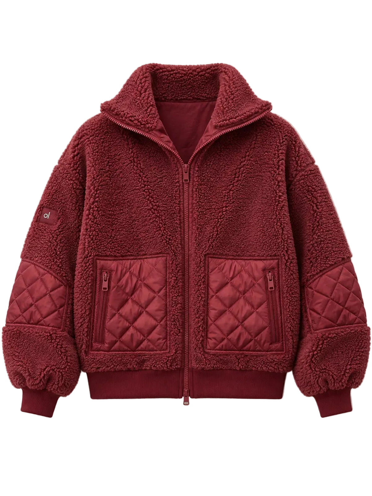 A deep red fleece zip-up jacket with quilted details on the pockets and sleeves, shown flat against a light beige background.