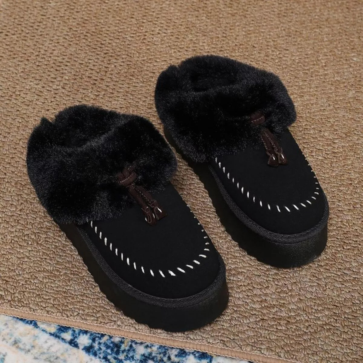 Plush faux fur-lined platform slippers with tassel detail