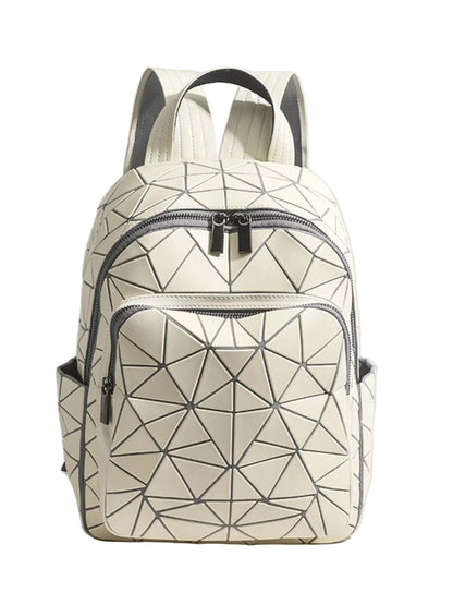 A geometric backpack in off-white with a black faceted triangle pattern, featuring a front zippered pocket and top handles, set against a solid light beige background.