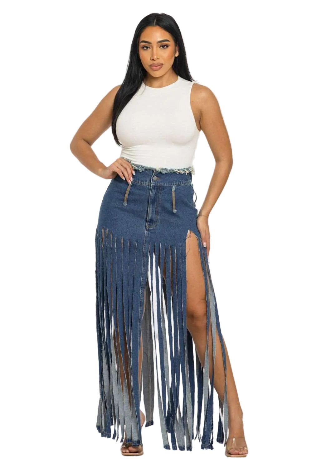 Woman wearing a white sleeveless top and denim skirt with fringe details on a white background