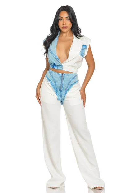Woman wearing a white and blue outfit with a plain background