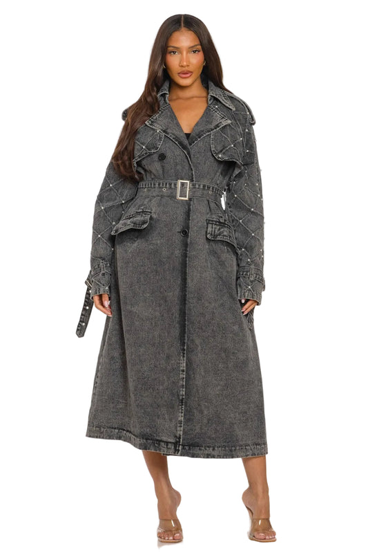 Woman wearing a gray trench coat on a white background