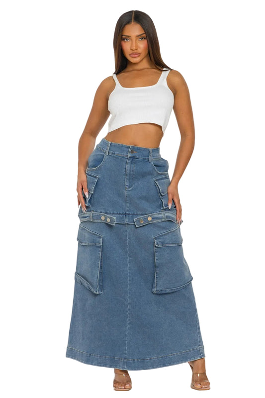 Woman wearing a white crop top and blue denim skirt on a white background