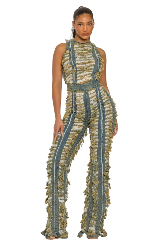 Woman wearing a patterned jumpsuit on a white background