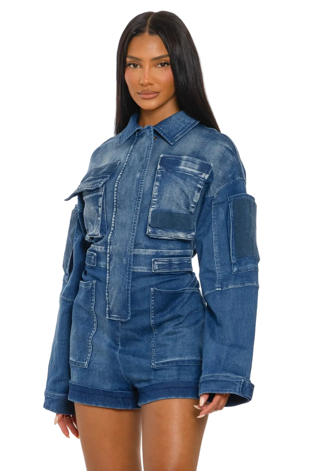 Woman wearing a blue denim romper on a white background