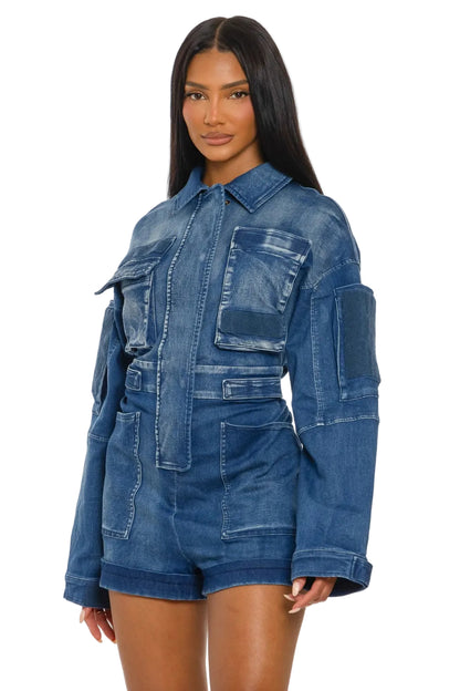 Woman wearing a blue denim romper on a white background