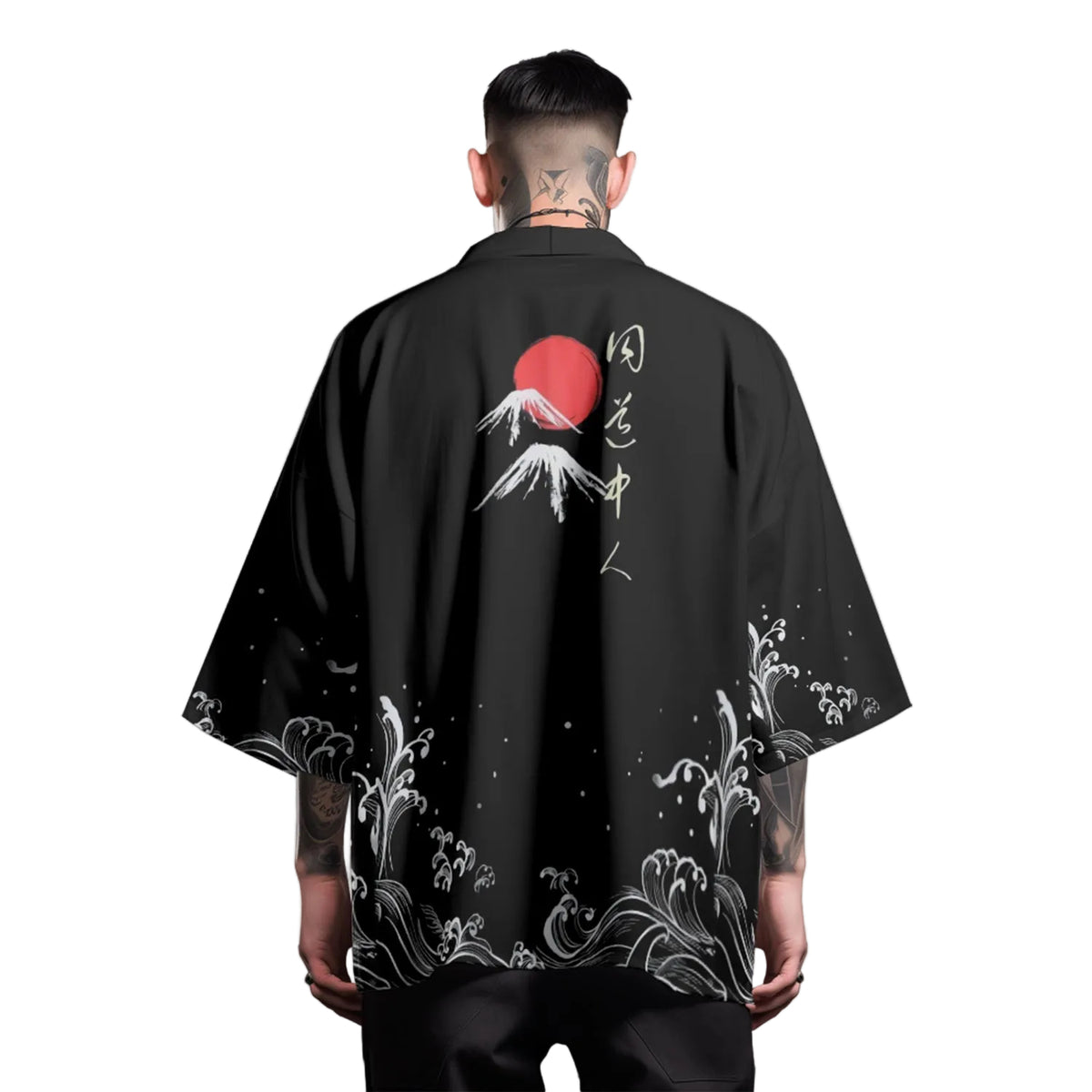 Person wearing a black kimono-style garment with Japanese-themed designs on a gray background
