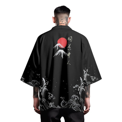 Person wearing a black kimono-style garment with Japanese-themed designs on a gray background