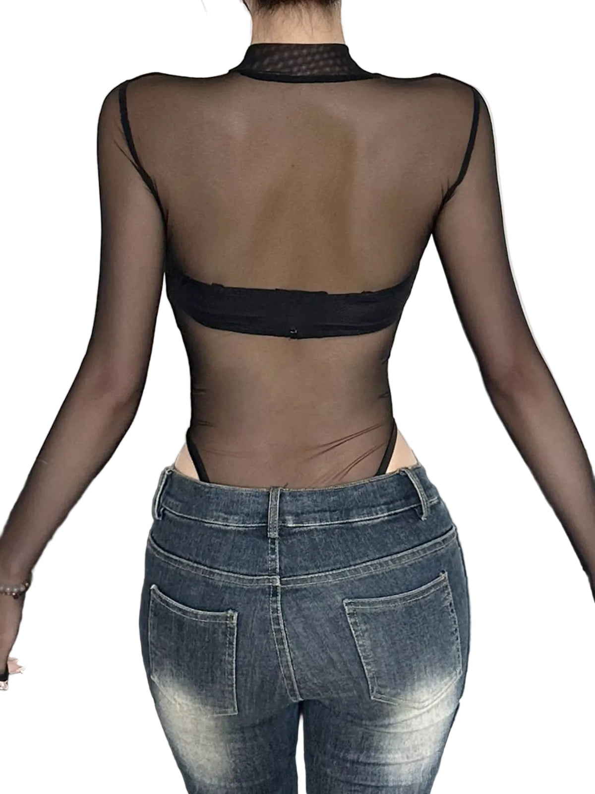 Person wearing a sheer top and jeans with a neutral background