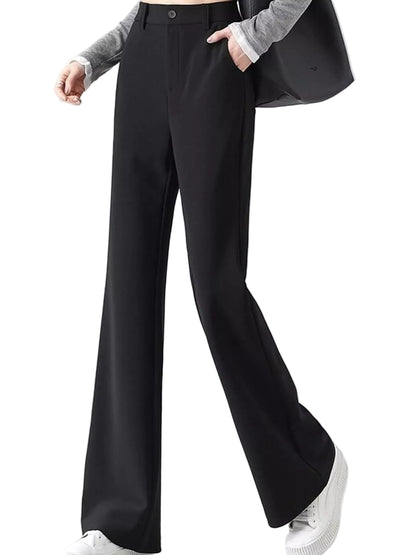 A model wearing black wide-leg trousers with a button closure, paired with a gray long-sleeve top, white sneakers, and a black shoulder bag against a light gray studio background.