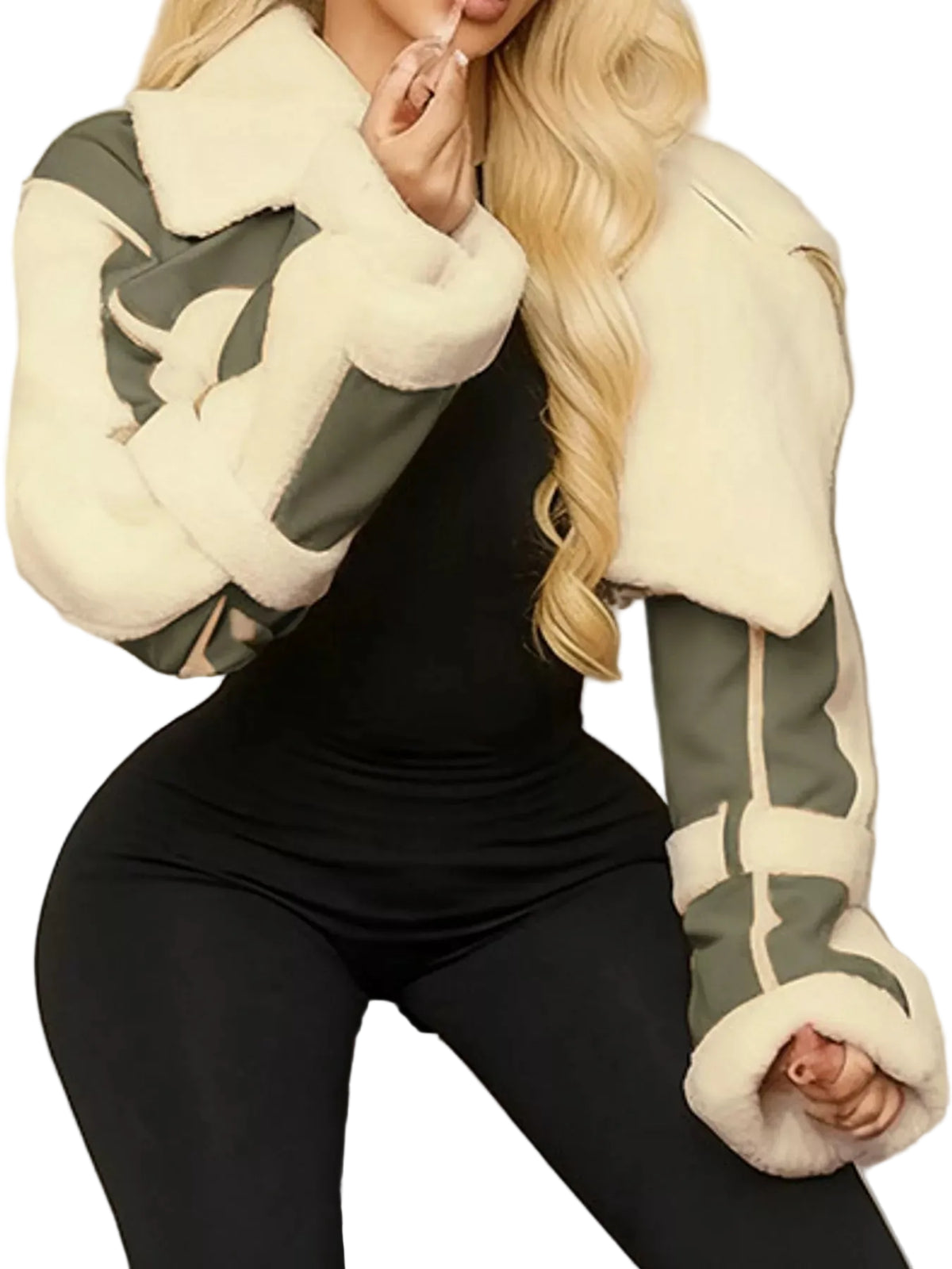 A woman wearing a cropped shearling jacket with cream-colored plush lining and olive green panels, paired with a black bodysuit and black leggings.