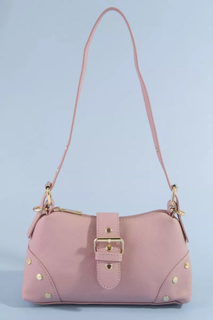 Pink handbag with gold accents on a light blue background
