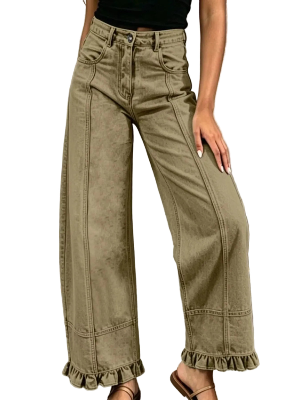 A person wearing high-waisted wide-leg jeans in an olive khaki color, styled with a black top and brown sandals against a textured gray concrete wall.