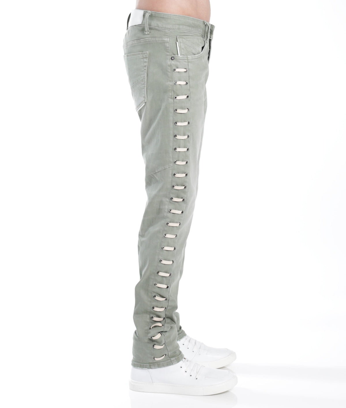 Light gray ripped jeans worn by a person on a white background