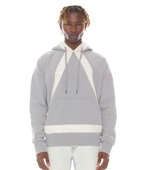 Person wearing a gray and white hoodie on a white background