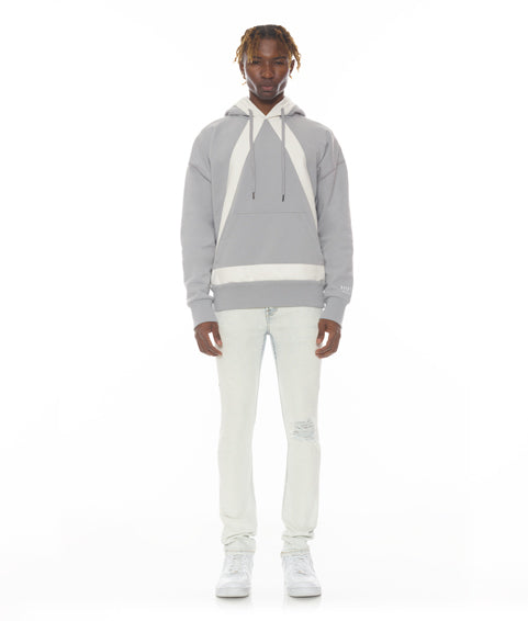 Person wearing a gray hoodie with white accents on a white background