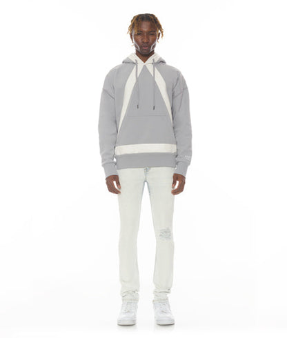 Person wearing a gray hoodie with white accents on a white background