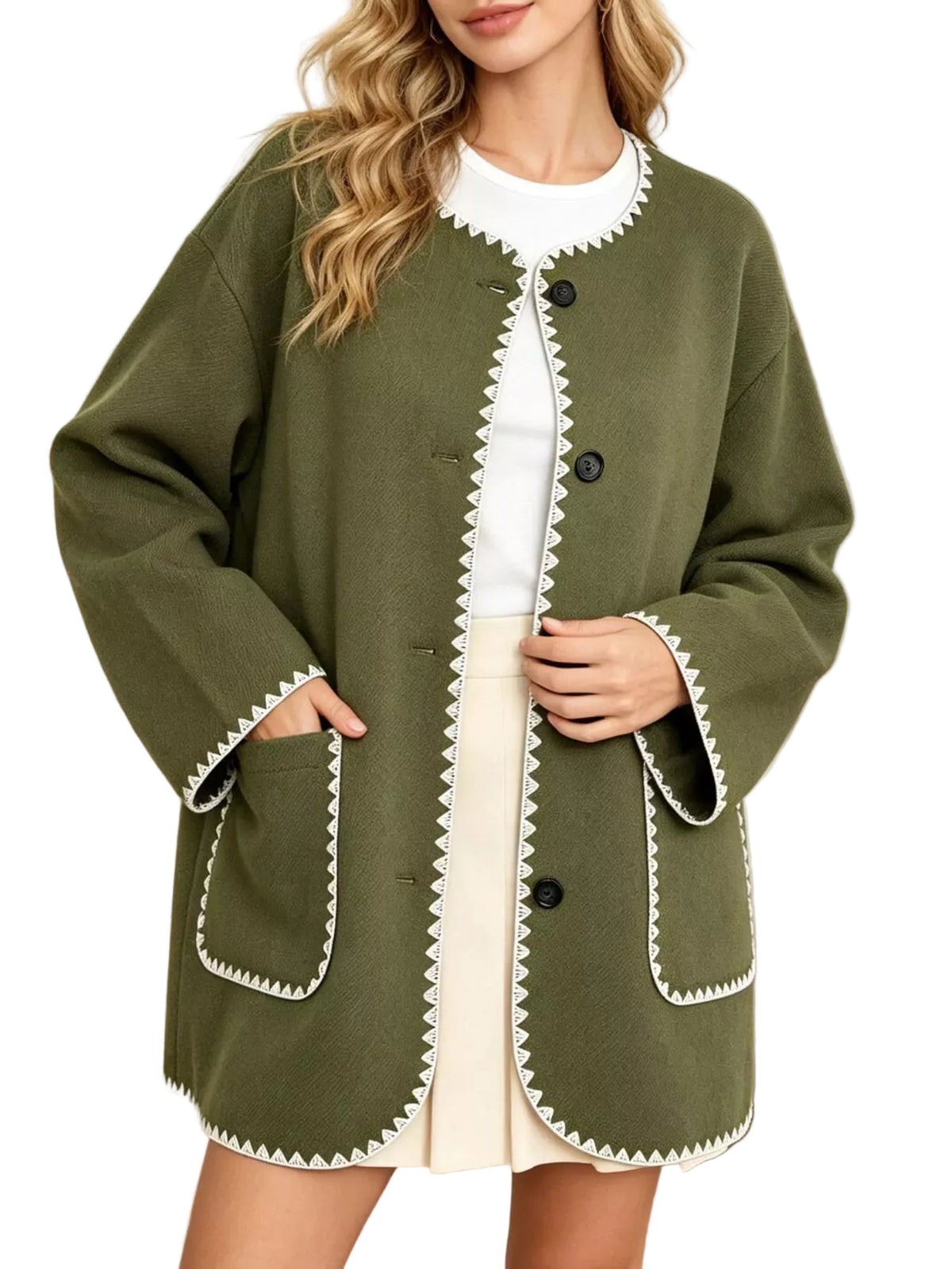 A woman wearing an olive green button-front cardigan with white scalloped trim, layered over a white top and cream skirt, in a bright indoor setting.