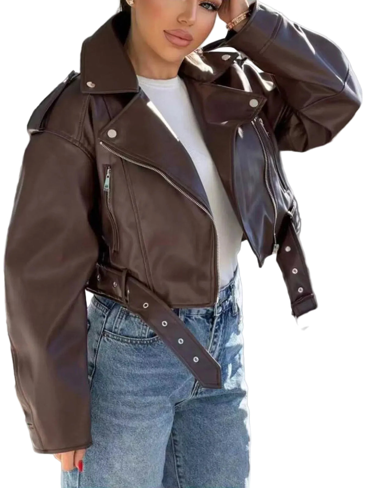A woman wearing a dark brown faux-leather moto jacket with a matching belt, styled over a white t-shirt and blue jeans.