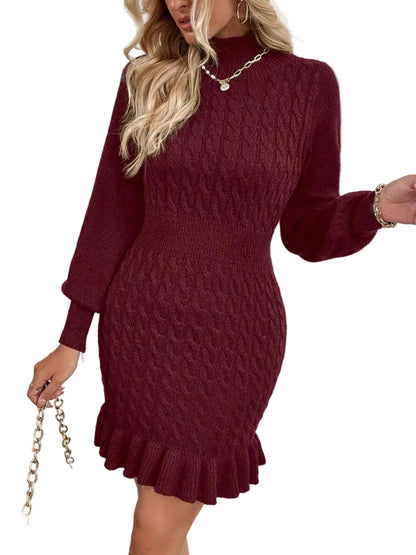 Woman wearing a burgundy knitted dress against a white background