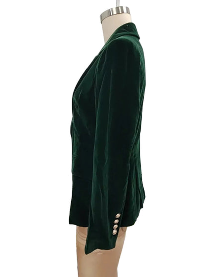 Green dress on a mannequin against a white background
