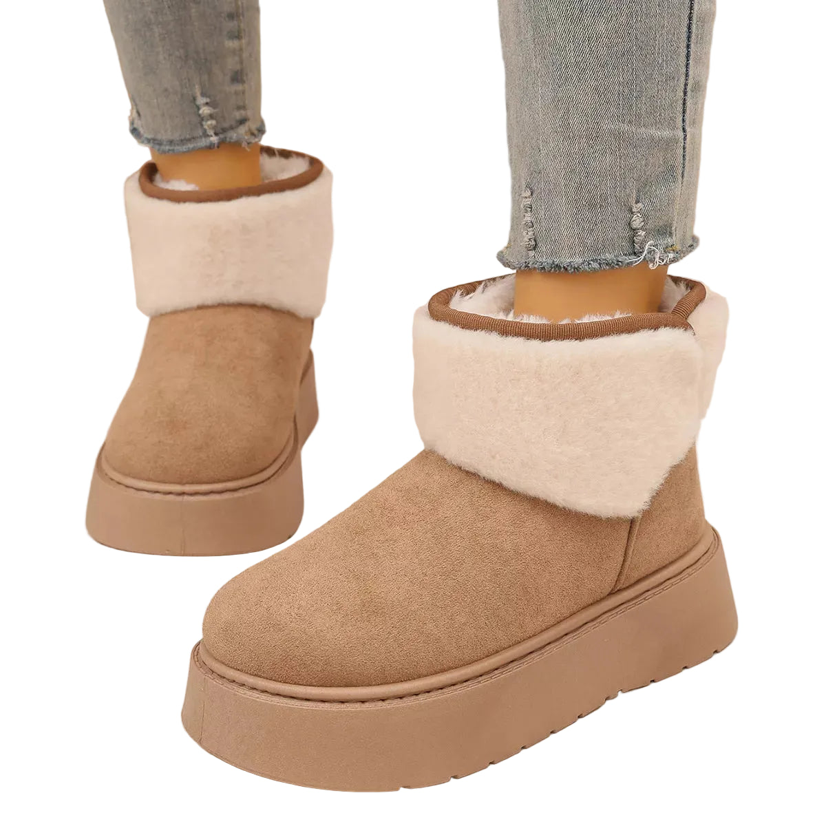 A pair of beige suede-like ankle boots with thick platform soles and fluffy white faux-fur trim, shown on a person wearing light blue frayed-hem jeans.