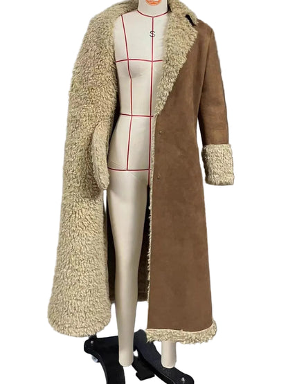 A long open-front coat displayed on a mannequin in front of window blinds. The coat has a tan suede-like outer panel and a cream sherpa/fleece lining, with the mannequin showing red measurement guide lines.