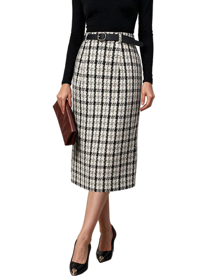 A woman models a black and beige tweed plaid midi skirt with a black belt, paired with a black long-sleeve top, black pointed-toe heels, and a brown clutch, set against a neutral indoor background.