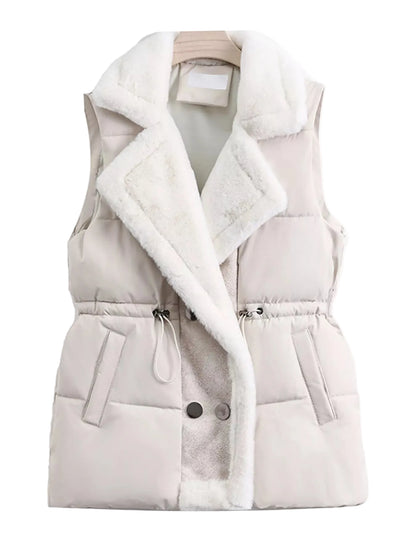 A sleeveless puffer vest in a light beige or cream color, featuring a thick white faux-fur collar and lining, with a drawstring waist and snap buttons, shown on a hanger against a plain white background.