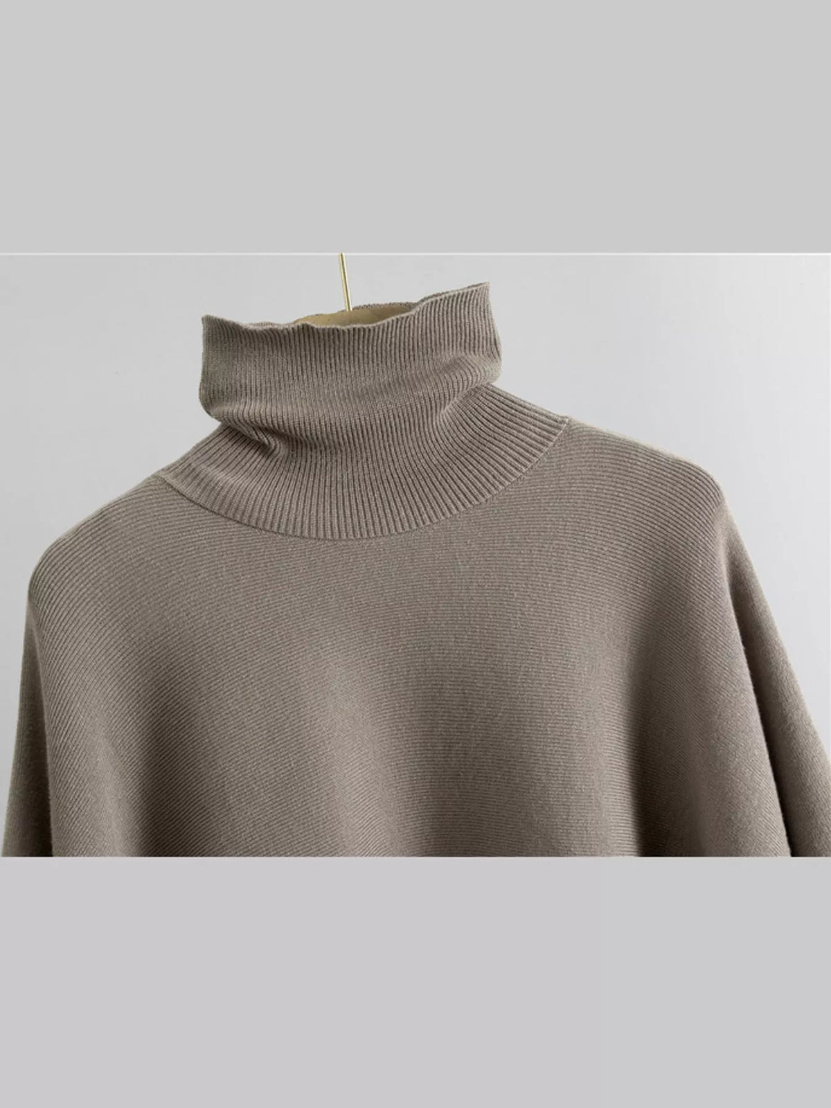 Turtleneck poncho sweater and matching wide-leg knit pants set