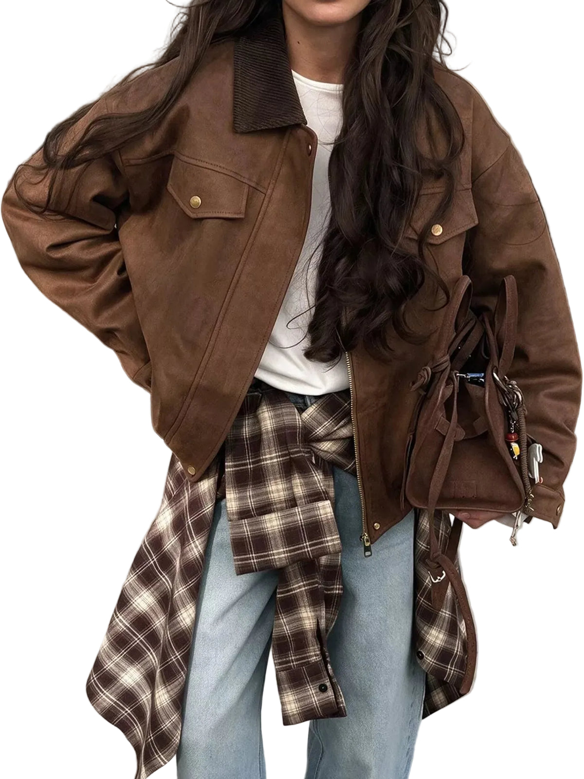 A person wearing an oversized brown suede-like jacket over a white top, with a brown plaid shirt tied around the waist and light blue jeans. A matching brown shoulder bag is also visible.