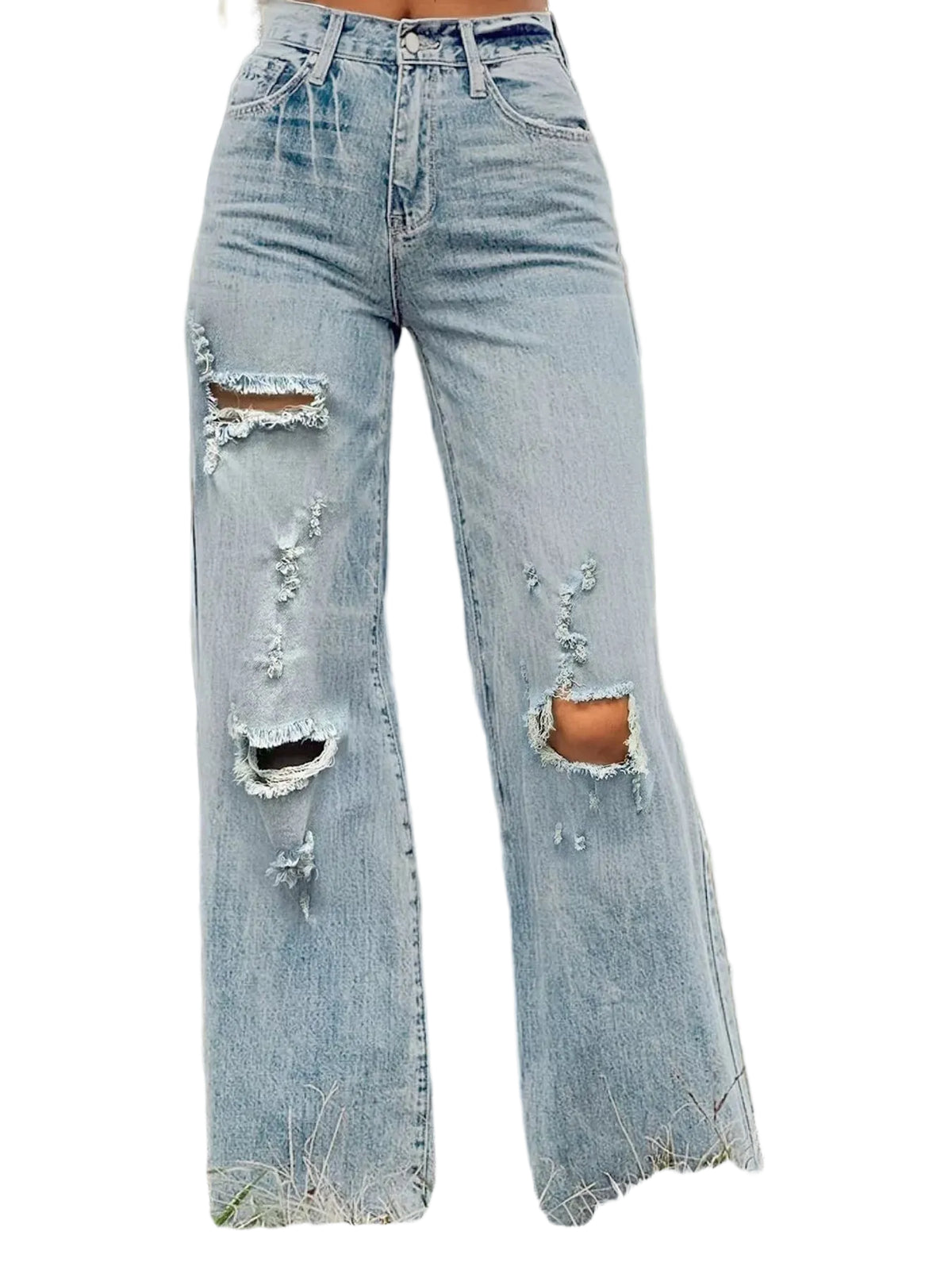 Light-wash distressed wide-leg jeans with ripped details on the thighs and knees, shown on a model standing in an outdoor grassy field.
