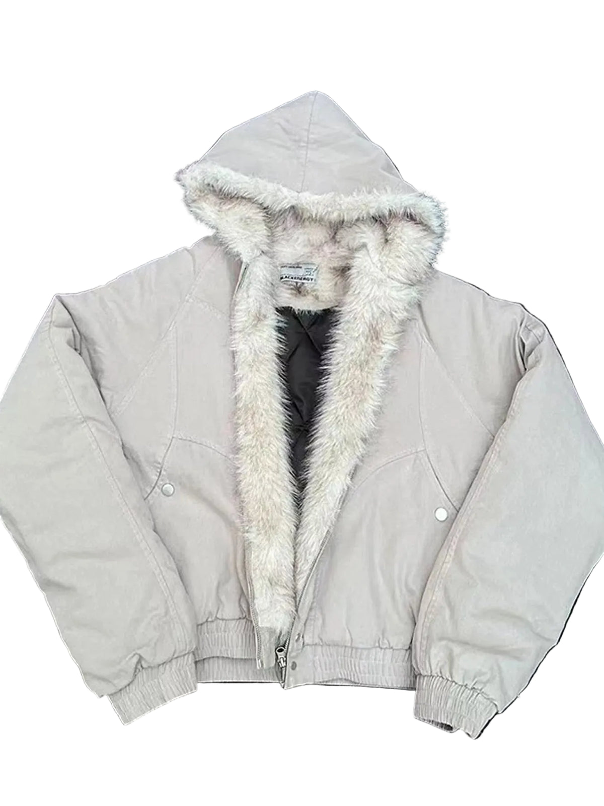 A light beige hooded jacket with a thick cream faux-fur trim, laid flat on a dark asphalt surface.