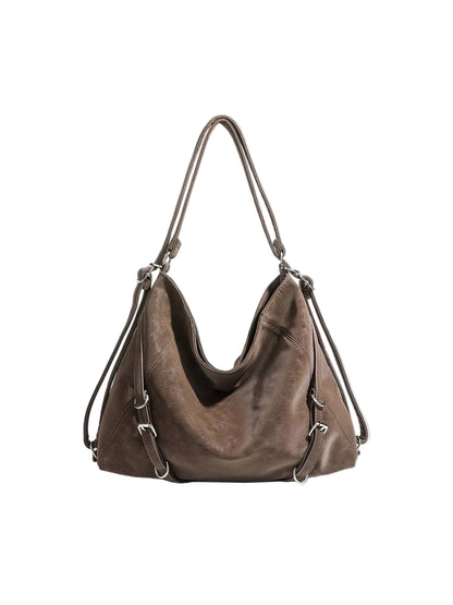 A brown leather hobo shoulder bag with silver-tone hardware, displayed against a light gray background.