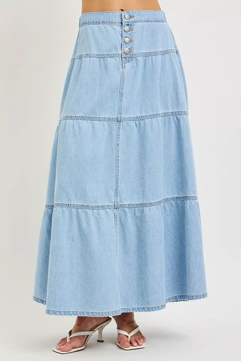 Light blue denim skirt on a plain background