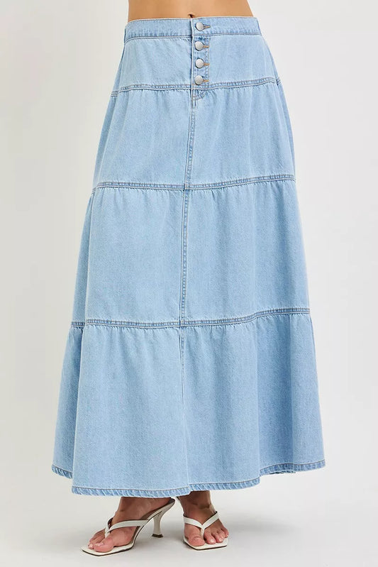 Light blue denim skirt on a plain background