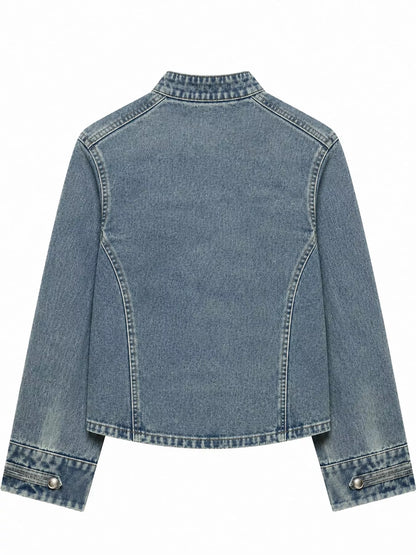 A cropped light blue denim jacket with a mock neck, long sleeves, and buttoned cuffs, shown from the back on a plain white background.