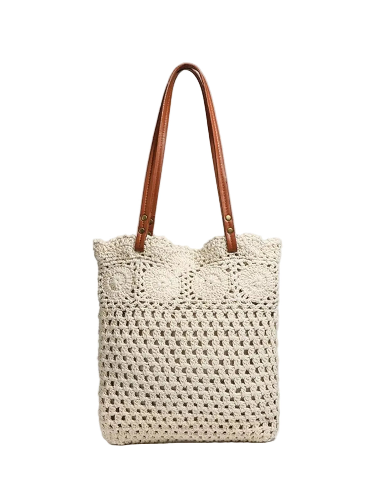A cream-colored crocheted tote bag with brown leather shoulder straps, shown against a light gray background.