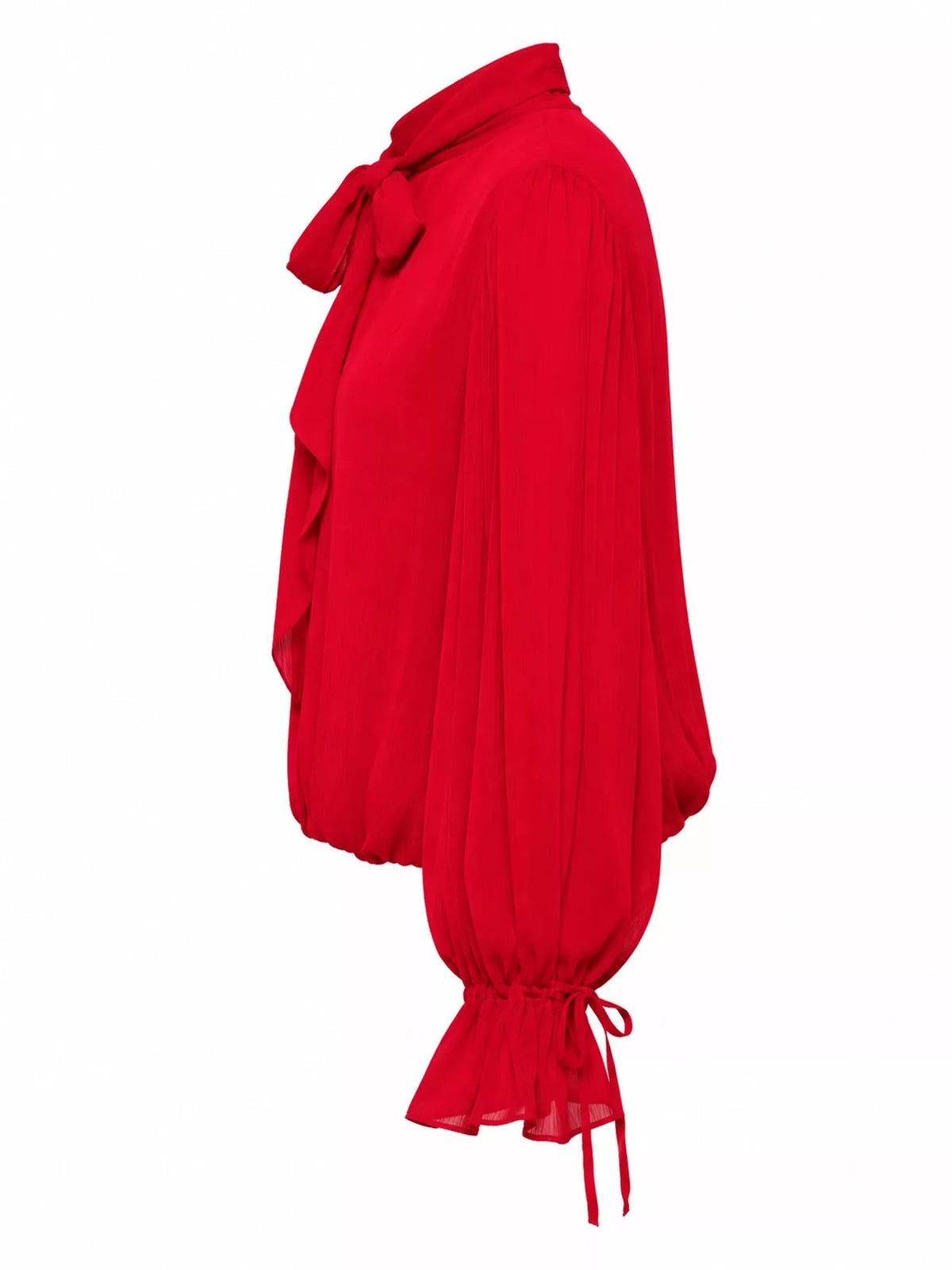 A bright red blouse shown from the side, featuring a high collar with a large bow, voluminous long sleeves, and a gathered drawstring hem, set against a plain white background.