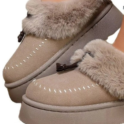 Plush faux fur-lined platform slippers with tassel detail