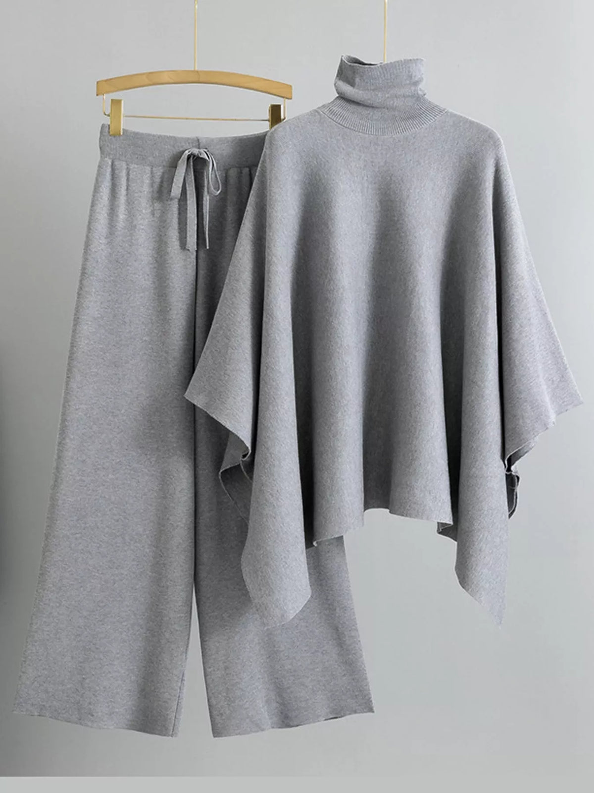 Turtleneck poncho sweater and matching wide-leg knit pants set