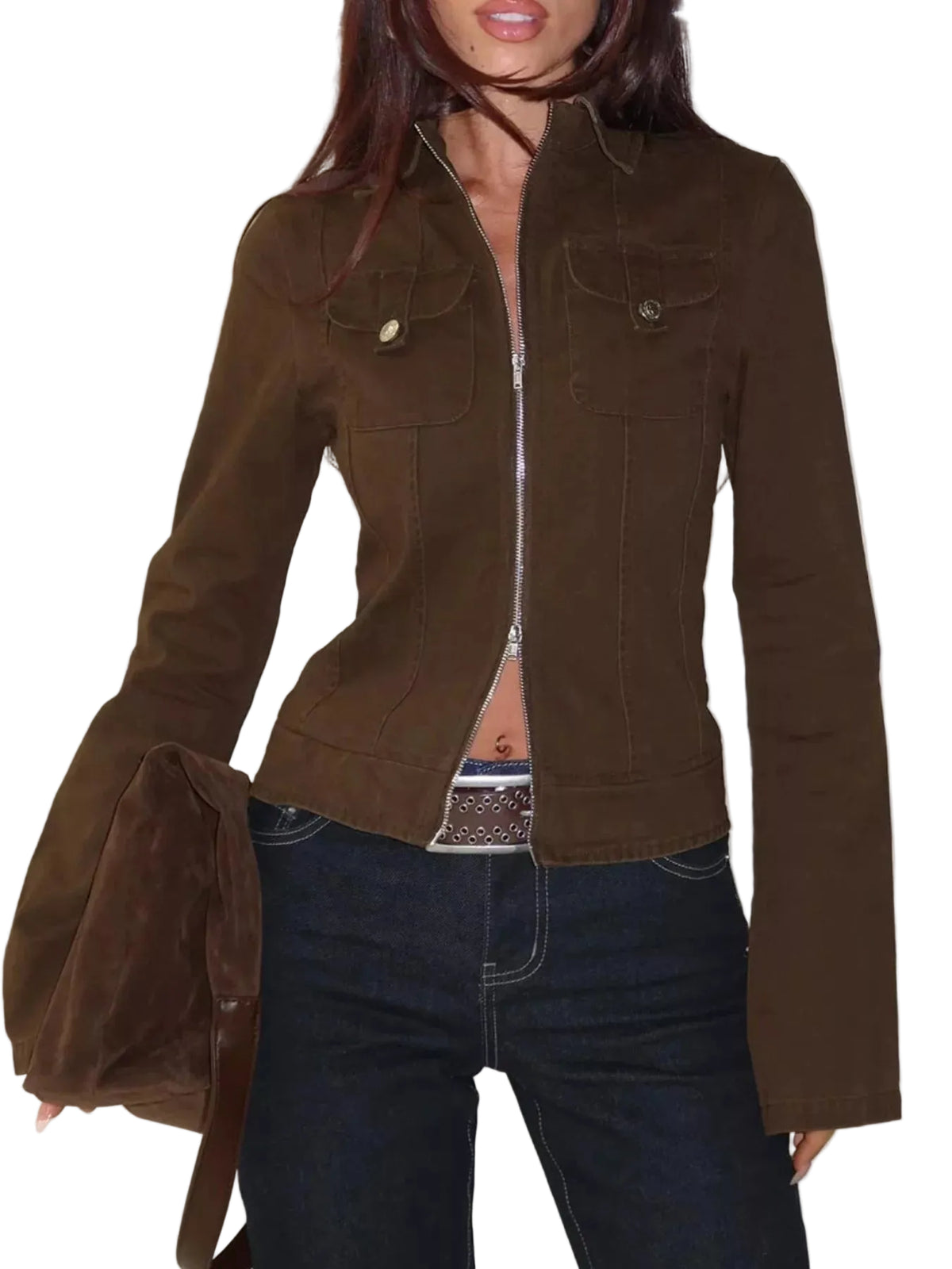 A woman wearing a cropped brown jacket with a front zipper, flap chest pockets, and dark blue jeans, holding a matching brown bag against a white studio background.