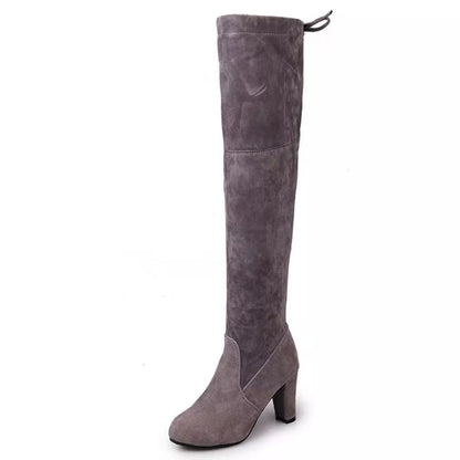 Gray suede knee-high boot on a white background