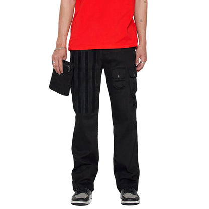 Person wearing black cargo pants and a red shirt on a white background